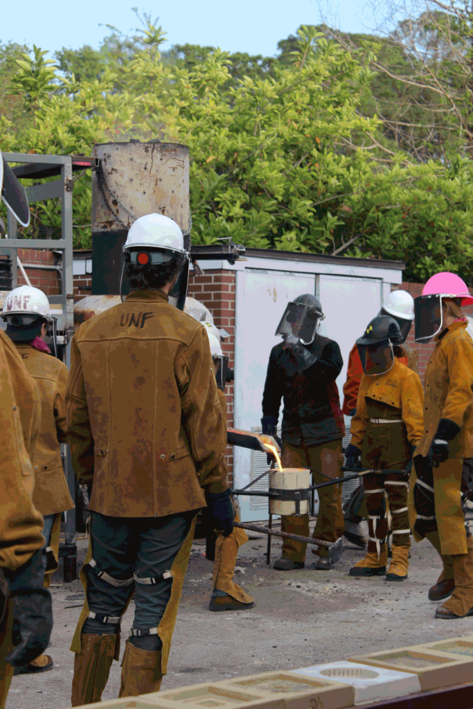 Tapping the furnace for molten iron