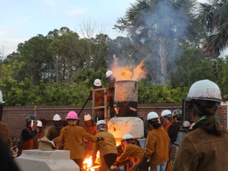 Tapping the furnace and spilling iron