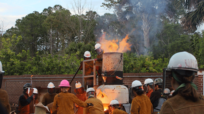 unf_iron_pour_spring_2017_tapping2 Tapping the furnace and spilling iron