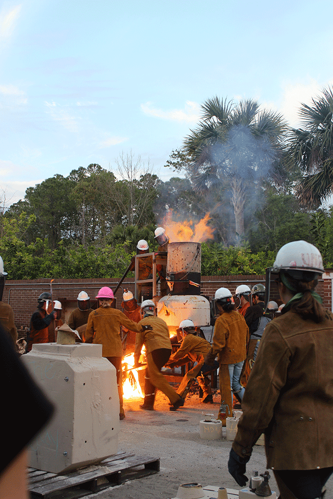 Tapping the furnace and spilling iron